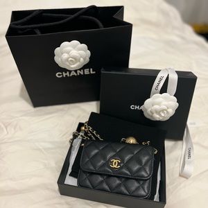 Chanel black lambskin mini belt bag.